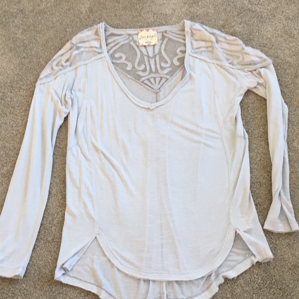 Free people women’s top with lace detail.